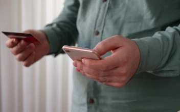 Stock Video Entering Bank Data On A Smartphone For PC