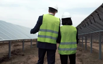 Stock Video Engineers Working Through Solar Field For PC