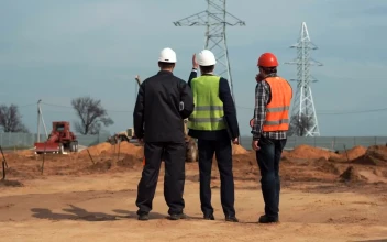 Stock Video Engineers Talking In Front Of The Electrical Towers For PC