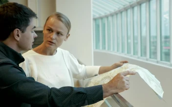 Stock Video Engineers Looking At A Layout For PC