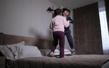 Stock Video Energetic Children Jumping On A Bed For PC