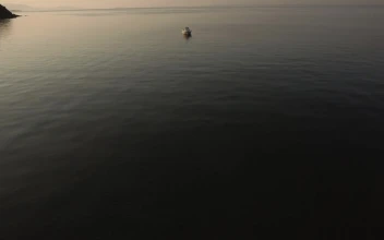Stock Video Empty Boat Anchored Off The Coast For PC