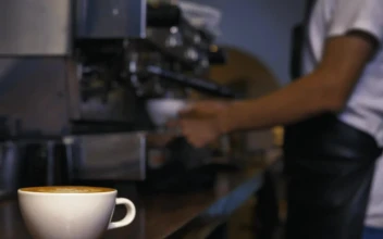 Stock Video Employee Serving A Cup Of Coffee From A Machine For PC