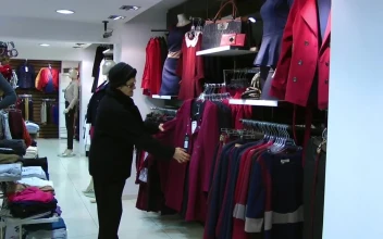 Stock Video Elderly Woman Shopping For Clothes For PC
