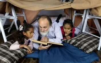 Stock Video Elderly Man Reading A Book To Children For PC