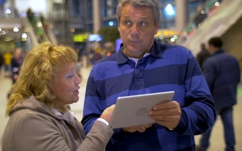 Stock Video Elderly Couple Using A Tablet While Out In Town For PC