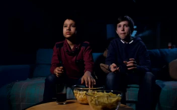 Stock Video Eating Popcorn While Watching A Horror Film For PC