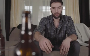 Stock Video Drunk Young Man Watching Television For PC