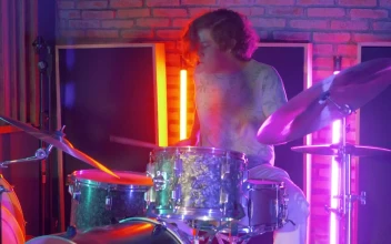 Stock Video Drummer Playing In A Studio With Neon Lights For PC