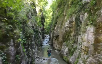Stock Video Drone Tour Above A River Between Two Mountains For PC