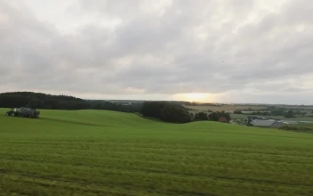 Stock Video Drone Following A Tractor For PC
