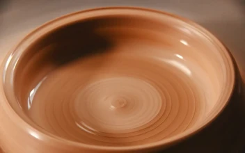 Stock Video Dripping Water Into Spinning Clay For PC