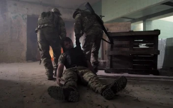 Stock Video Dragging A Wounded Marine Out Of A Building For PC