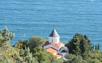 Stock Video Dome Of A Church Near The Sea From Afar For PC