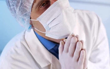 Stock Video Doctor With Face Mask Praying To Heaven For PC