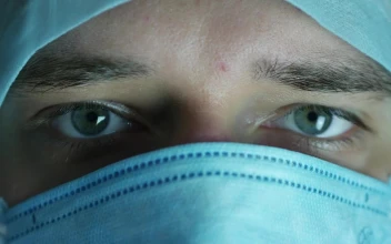 Stock Video Doctor With A Face Mask Closes His Eyes For PC