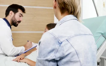 Stock Video Doctor Questions Young Girl On Hospital Bed For PC