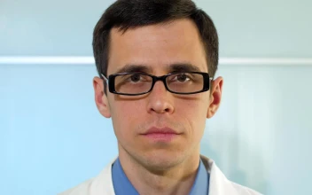 Stock Video Doctor Puts On A Mask In The Hospital Portrait For PC