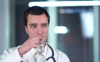 Stock Video Doctor Drinking Form A Plastic Cup For PC