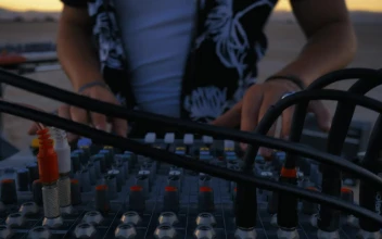 Stock Video Dj Using A Console Mixing In A Desert For PC