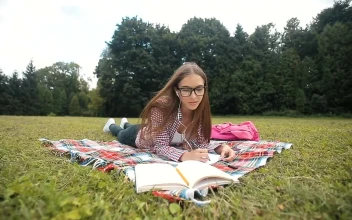 Stock Video Distance Education Student Listens To Lecture In Park For PC