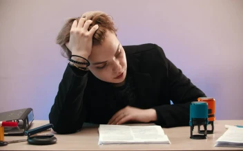 Stock Video Discouraged Woman Sealing Sheets In Her Office For PC