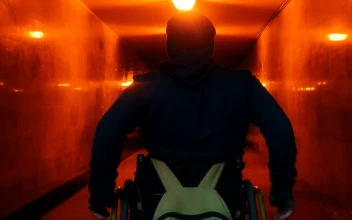 Stock Video Disabled Man In A Wheelchair Crossing An Underpass Tunnel For PC