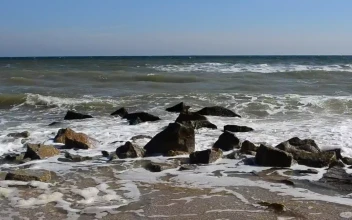 Stock Video Dirty Seawater Breaking Over Rocks For PC