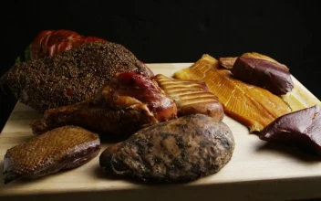 Stock Video Different Types Of Meat Rotating On A Wooden Board For PC
