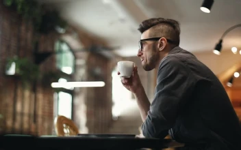 Stock Video Developer Types On Laptop In Cafe And Sips Coffee For PC