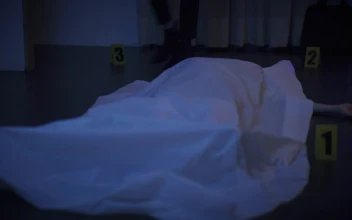 Stock Video Detective Woman Checking A Body At A Crime Scene For PC