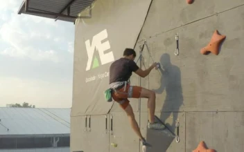 Stock Video Descending A Large Mountaineering Wall With A Rope  Smal For PC