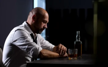 Stock Video Depressed Man With A Bottle Of Whisky For PC