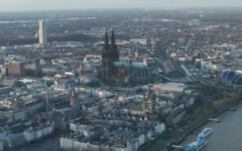 Stock Video Mixkit Flying Over A German City With A Large Cathedral Smal For PC