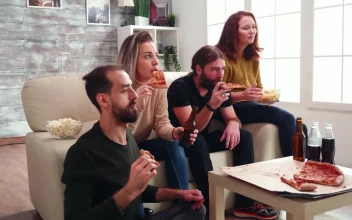 Stock Video Friends Eat Pizza And Celebrate Victory For PC