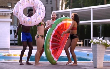 Stock Video Friends Dancing By The Pool For PC