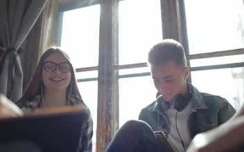 Stock Video Friends Celebrate Win With A Hi Five In Sunlit Room For PC