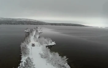 Stock Video Freezing Waters Around A Snow Covered Ridge For PC