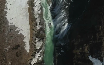 Stock Video Freezing Water Breaking Over A Waterfall For PC