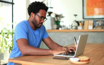 Stock Video Freelancer Working From A Small Coffee Shop For PC