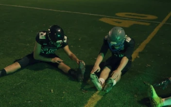 Stock Video Football Team Stretching On A Field For PC