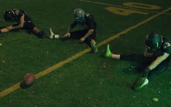 Stock Video Football Team Stretching In The Football Court For PC