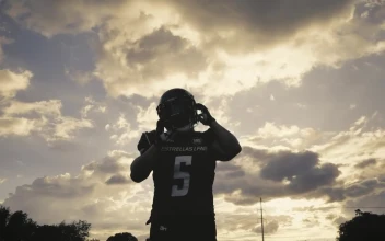 Stock Video Football Player Taking Off His Helmet For PC