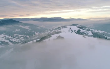 Stock Video Foggy Winter Wonderland Seen From The Air For PC