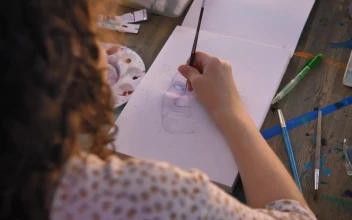 Stock Video Focus On The Hand Of An Artist Girl Painting With For PC