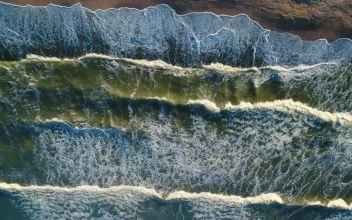 Stock Video Foamy Ocean Waves Colliding With A Shoreline For PC