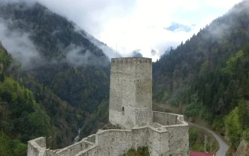 Stock Video Flying Through An Old Castle Towards The Forested Mountains For PC