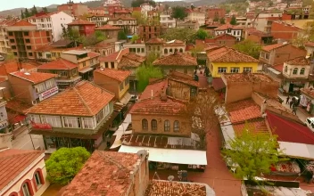 Stock Video Flying Slowly Over A Beautiful Town For PC