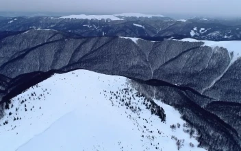 Stock Video Flying Over Rocky Mountains In Winter For PC