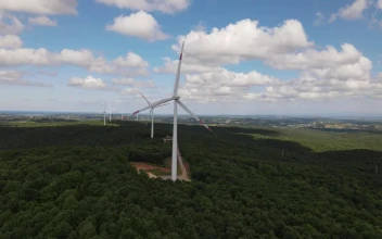 Stock Video Flying Over A Wind Farm On A Sunny Day For PC